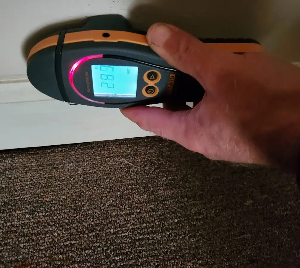 Moisture detection at baseboard during Storm Damage Restoration in Chicopee